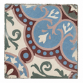 Antique French cement tile with dusty-blue floral forms, burgundy detailing, and green scrollwork.